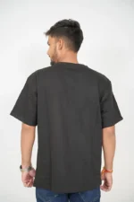 Rear view of male model wearing plain black t-shirt