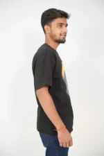 Side view of man in black short-sleeve t-shirt