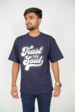 Man wearing plain navy blue t-shirt with jeans, front view