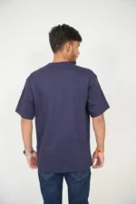 Rear view of man wearing plain navy blue round-neck t-shirt