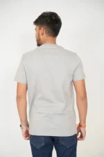Rear view of man wearing plain grey t-shirt and jeans