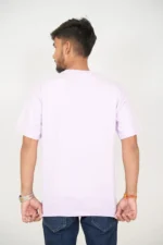 Rear view of man wearing plain lavender oversized t-shirt