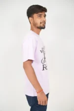 Man wearing lavender t-shirt viewed from right side