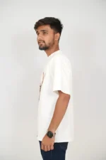 Man in white casual t-shirt and jeans posing from left side