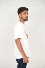 Man in white short-sleeve t-shirt viewed from right side