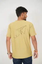 Rear view of man in plain mustard yellow crew-neck t-shirt
