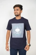 Man in navy blue round-neck t-shirt and jeans, front view