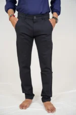 Man wearing black formal trousers and blue shirt, front view, relaxed fit