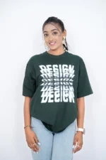 Woman in dark green oversized t-shirt and light jeans, front-facing