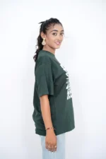 Woman modeling dark green t-shirt from the right side