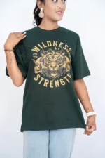 Woman wearing oversized dark green t-shirt and jeans, front view