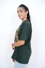 Female model in dark green t-shirt posing from left side