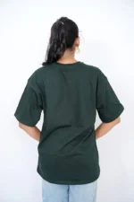 Back view of woman wearing oversized green t-shirt