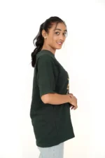 Right profile of woman wearing dark green loose-fit t-shirt