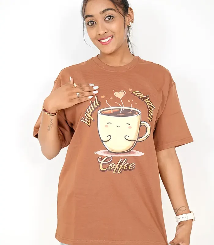 Woman wearing loose brown t-shirt, front-facing with jeans