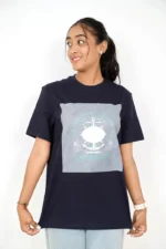 Woman wearing navy blue t-shirt and light jeans facing forward