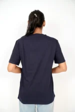 Rear view of woman in plain navy blue t-shirt