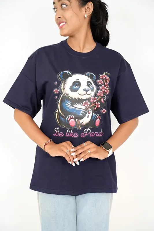 Woman wearing navy blue oversized t-shirt and light jeans, front view