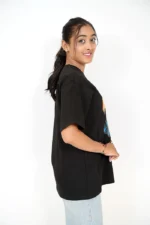 Left profile of woman modeling casual black t-shirt