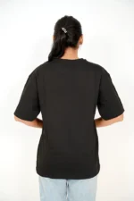 Rear view of woman in oversized black t-shirt