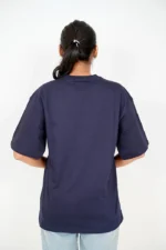Back view of woman in navy blue oversized t-shirt