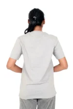 Rear view of woman in light grey plain crew-neck t-shirt