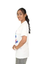 Woman modeling white loose t-shirt from right side