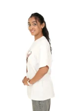 Right side view of woman in plain white round-neck t-shirt