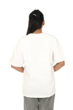 Rear view of woman in oversized white t-shirt