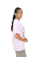 Woman wearing lavender t-shirt viewed from left side