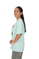 Woman in mint blue casual t-shirt from right side profile