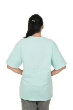Rear view of woman in plain mint blue round-neck t-shirt