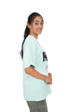 Side profile of woman in mint green t-shirt facing left